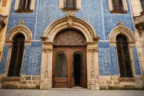 Porto University architecture, Baroque-style building, grandiose entrance, ornate stone carvings, intricate façade details, symmetrical composition, vibrant blue tiles, rustic wooden doors, granite fl