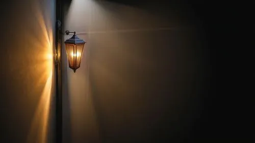 a close up of a light on a wall,wall light,lamplight,hanging light,wall lamp,porchlight,streetlight,incandescent lamp,street light,street lamp,streetlamp,the light bulb,footlight,light bulb,hanging bu