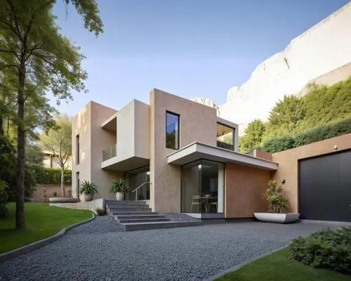 vegetación ya ambiente con personas en un residencial,a modern house on a large stone hill,modern house,cubic house,modern architecture,residential house,cube house,dunes house,contemporary,house shap