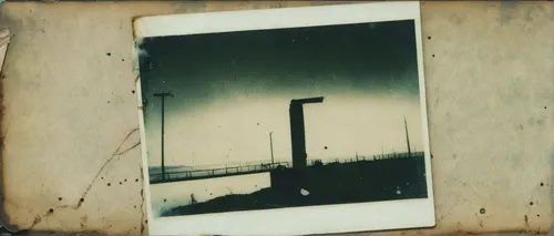 Create a suspenseful Leakhub investigation set in a dystopian future.,dungeness,lubitel 2,ambrotype,oresund bridge,enlarger,agfa isolette,lamppost,transporter bridge,old pier,industrial landscape,west