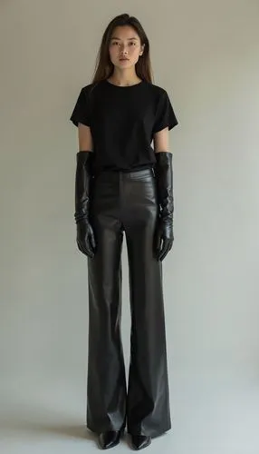 *"A young woman stands still against a neutral background, her posture calm and composed. The tips of her impossibly tall, pointed sleek leather boots gently touch, with her toes turned inward, creati