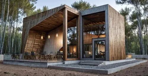 the interior view of a house with wood and metal details,timber house,cubic house,forest house,wooden house,cube house,inverted cottage,dunes house,tree house hotel,house in the forest,mirror house,tr