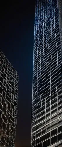 Modern skyscraper, urban landscape, architectural wire mesh exterior, geometric pattern, metallic silver material, reflective surface, city lights reflection, nighttime scene, low-angle shot, dramatic
