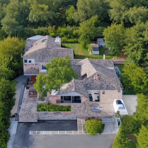 Vivienda de dos dormitorios con baño en suite, living, cocina comedor,this is an aerial view of a house in the woods,aerial image,private estate,drone image,aerial view,bird's-eye view,roof landscape,