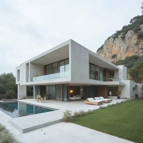 ,a very large house on the edge of a mountain,modern house,dunes house,modern architecture,house by the water,lago grey,house in the mountains,house in mountains,luxury property,fresnaye,cube house