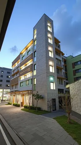 a tall building sitting next to two other buildings,school of medicine,university hospital,dormitory,campus,modern building,biotechnology research institute,new building,dormitories,medical center,pol