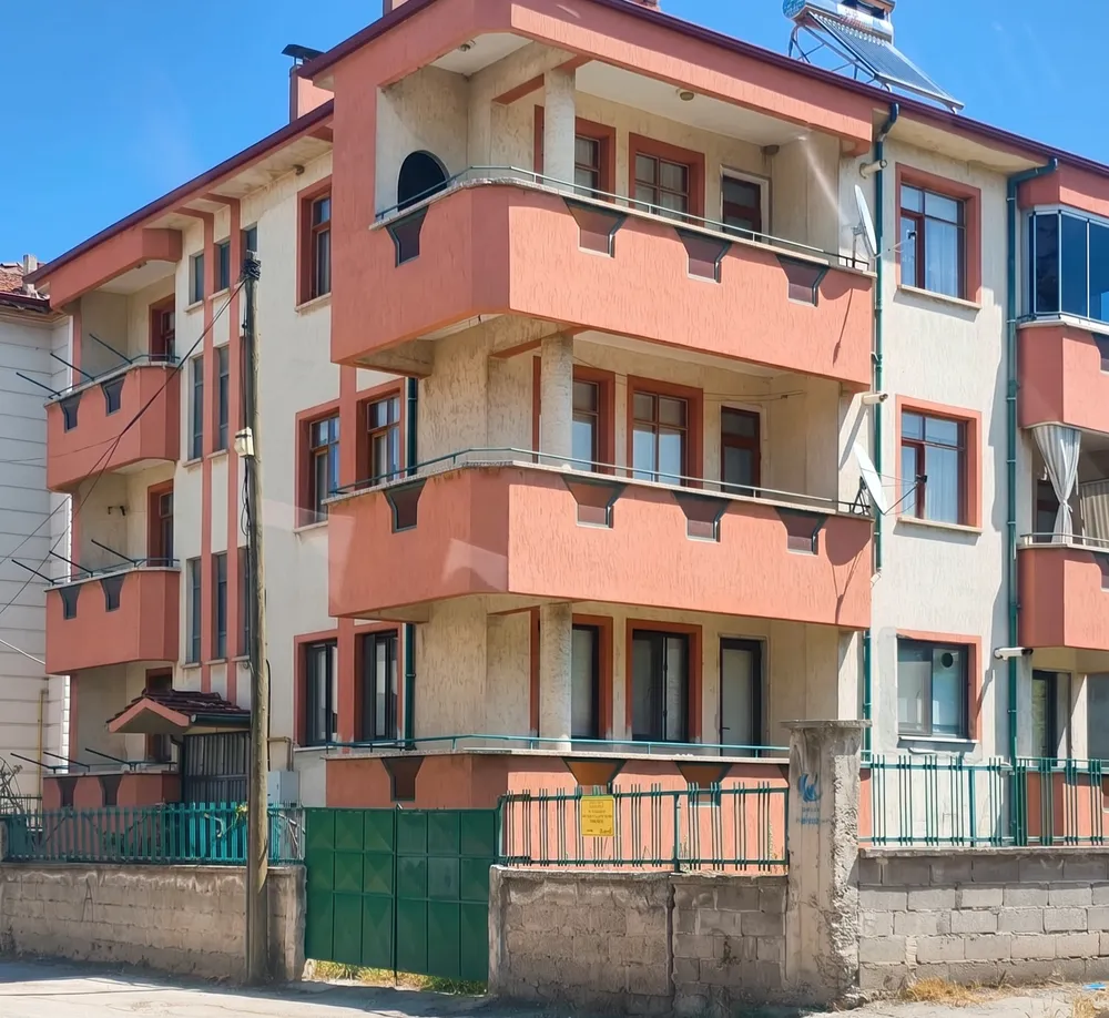 an apartment building in the middle of a residential area