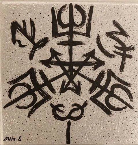 a sign in a museum showing a bunch of symbols,stencils,ideograms,motifs,stencil,motifs of blue stars,hexagram,witches pentagram,esoteric symbol,six pointed star,runic,six-pointed star,runes,ceramic ti
