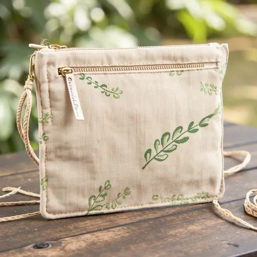 A rustic zipper pouch made from beige canvas material with visible fibers, exuding a natural, eco-friendly aesthetic. The zipper is made of brass with a chunky pull tab, adding a touch of vintage char