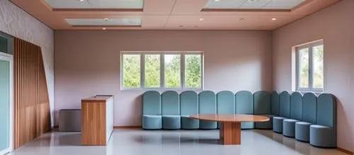international kids school reception area n waitng area ,a room filled with blue seats and a wooden table,examination room,lecture room,therapy room,periodontist,doctor's room,treatment room,hospitalie