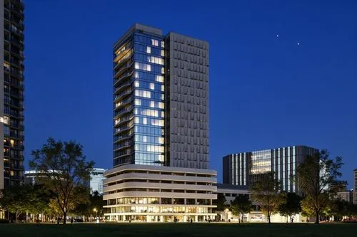 a building at night that's reflecting the sky,residential tower,renaissance tower,high-rise building,tower block,high rise building,condos,condominiums,night view,international towers,condo,residentia
