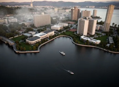 Modern city, by the lake, at dusk,some buildings water and boats on the water,false creek,west lake,aerial shot,pan pacific hotel,aerial photography,riversides,marina bay,old city marina,foster city,d