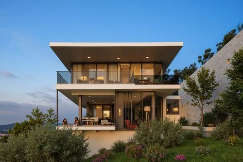 A photo-realistic rendering of a modern house on a hillside at dusk. the house is a two-story structure with a flat roof and large glass windows that allow a glimpse of the interior. The exterior wall