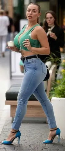 walking on open high heels on street,a woman walking on the sidewalk with her coffee,rollerskating,jiggle,woman free skating,female model,foot model,jeans background,high heel,heel,woman walking,jiggl