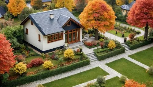 The heart of a cozy cottage is bathed in the soft glow of autumn lamps as the gentle breeze rustles the leaves. A charming scene is made of enchanting hues of red, orange, and yellow. The garden is al