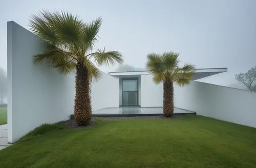 the front of a white house on a foggy day,dunes house,cube house,gwathmey,modern house,modern architecture,mahdavi