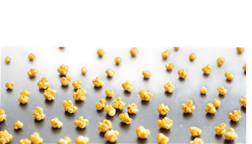 Golden popcorn, scattered, solo, close-up, realistic texture, crispy surface, salt sprinkles, warm lighting, shallow depth of field, cinematic composition, 3/4 view angle.,a black surface with a bunch