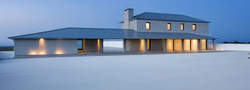 leds,the front facade of a large white home at twilight,roof landscape,flat roof,house roof,folding roof,roof terrace,turf roof,house roofs,dunes house,tiled roof,roof tile,pool house,danish house,sno