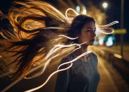 a woman that is outside on the street,drawing with light,lightpainting,light painting,light drawing,light trail,long exposure light,electrify,lightwaves,electrified,light paint,long exposure,burning h