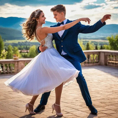a couple dancing in prom and the boy lifting up the girl in his arms and he is spinning her around ,ballroom dance,dancing couple,salsa dance,argentinian tango,latin dance,dancesport,dancers,dance,qui