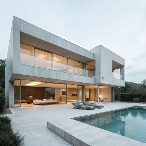 Modern Villa, Modern, Angular volumes, Polished concrete,a large pool sits outside of a large, modern house,modern house,modern architecture,dunes house,florida home,cube house,seidler,cantilevers,can