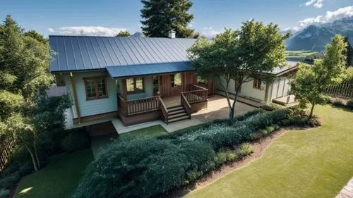 
Seam roof.,a large building with two levels of porch and steps leading to a deck with a picnic area,chalet,holiday villa,house in the mountains,roof landscape,annexe,chalets,wooden decking,grass roof