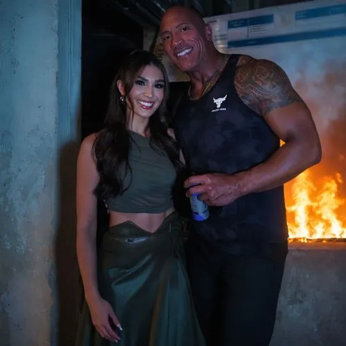 man and woman standing together in front of a fire,black couple,backstage,singer and actress,beautiful couple,hotshots,superstars,rumba,reigns,bodyguard,gladiators,blacksmiths,dungeon,clubbing,bonds,a
