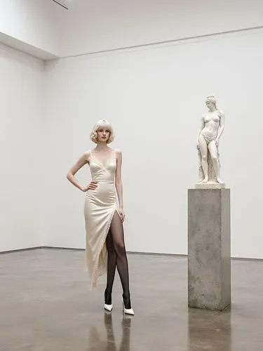 A realistic photograph inside a spacious minimalist contemporary art gallery with pristine white walls, high ceilings, and polished concrete floors reflecting ambient light. A tall rectangular raw con