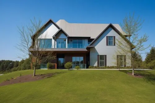 a large house sitting on top of a lush green hillside,modern house,house shape,cube house,grass roof,modern architecture,dunes house