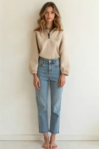 the woman stands next to a wall wearing jeans,chambray,topanga,high waist jeans,bellbottoms,madewell,culottes,denim shapes,jeans pattern,cashmere,menswear for women,denim bow,neutral color,high jeans,