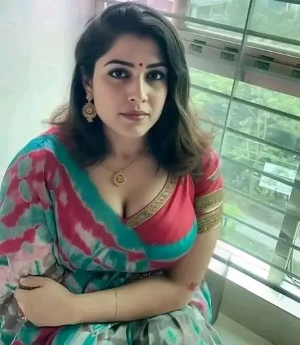 Woman ,a woman posing on the window sill with her arm crossed,janani,srividya,bhabhi,namitha,kushboo,roopa