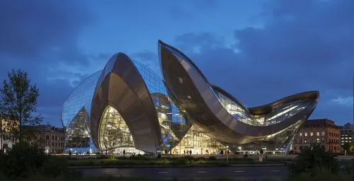 a tall building that has multiple curved windows,libeskind,morphosis,heatherwick,futuristic art museum,futuristic architecture,elbphilharmonie,calatrava,museumsquartier,bjarke,philharmonie