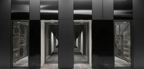 the narrow doorways are open to reveal a number of mirrors,turnstiles,antechamber,chamber,confinement,portcullis,elevators,arbitrary confinement,passageways,mortuaries,vestibules,doorways,imprisonment