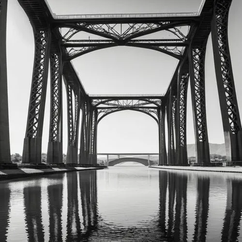 The image is a black and white illustration of a bridge spanning over a body of water. The bridge has multiple arches and is supported by sturdy pillars that are anchored into the riverbed below. The 