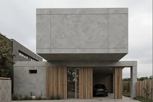 A modern minimalist house with a minimalist design, featuring a concrete facade and wooden doors. the house is located in a suburban area, with a cloudy sky visible in the background. on the middle of