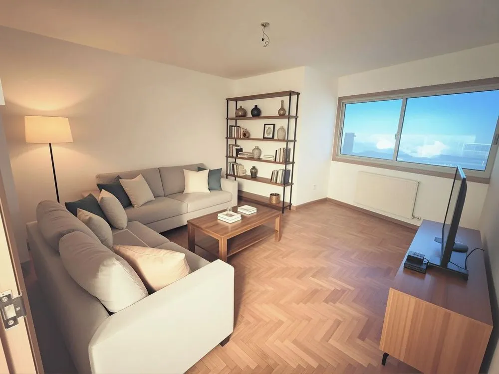 this living room has an open window and wooden floors