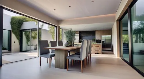 a modern kitchen area with large window and table,prefab,residential property,luxury home interior,penthouses,glass wall,contemporary decor