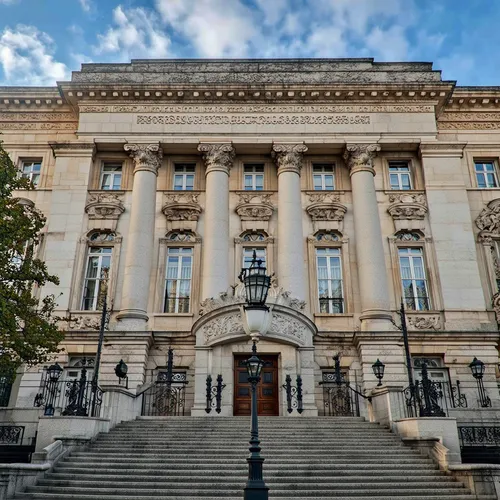 Big house of highest legislative body,a stone building with a clock on it,rudolfinum,bundesrat,riksdag,supreme administrative court,llotja,generalitat