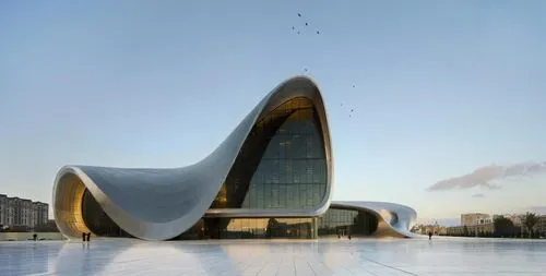 A building with a metallic style ,the design of a building is modern and curved,calatrava,azrieli,koolhaas,soumaya museum,libeskind,gerkin