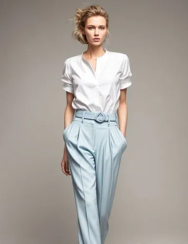 A beautiful fashion model in a commuter style outfit with light blue,menswear for women,asymmetric cut,pantsuit,woman in menswear,jumpsuit,mazarine blue,denim jumpsuit,women's clothing,trousers,suit t