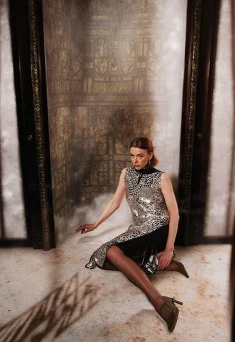 A stylish and sophisticated scene featuring Lisa Vicari elegantly dressed in a chic Fendi outfit, gliding gracefully through the grandiose interior of the Schlosshotel Berlin, a creation by Patrick He