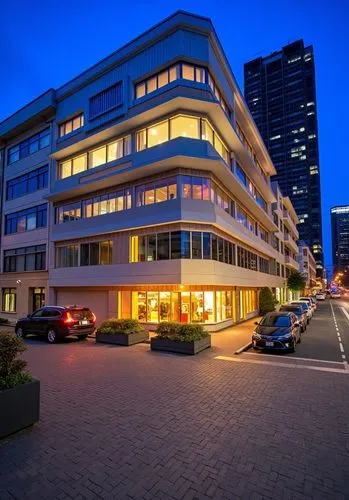a street corner with some cars parked in the front,novotel,appartment building,umhlanga,business centre,office building,eschborn,newbuilding,hotel complex,kigali,zoetermeer,strijdom,headquarter,danube