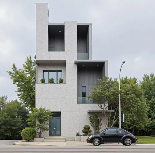 two cars are parked in front of a tall apartment building,modern architecture,cubic house,cube house,cantilevered,modern house,modern building,cantilevers,residential tower,residential building,reside