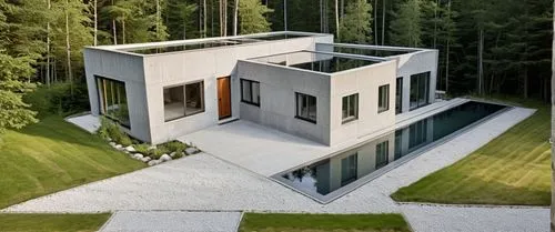 a house with large windows near the trees,cubic house,modern house,modern architecture,frame house,forest house,prefab,cube house,folding roof,house in the forest,inverted cottage,prefabricated,house 
