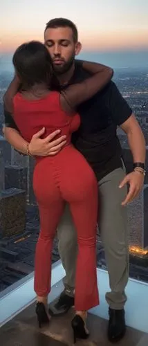 man and woman hugging in front of city skyline,kizomba,kompa,rooftop