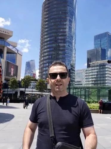 Handsome architect boy explains the skyscraper's parametric facade redesign, and the art is complete with the boy explaining the facade with repeating parametric patterns. The patterns, inspired by Ir