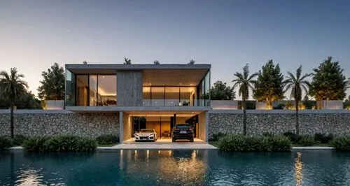 vivienda moderna de dos niveles, con muebles que se vean en segundo nivel, ventanales de cristal, muros de piedra a vista, vegetacion, jardin, pavimentos, iluminacion exterior e interior, auto deporti