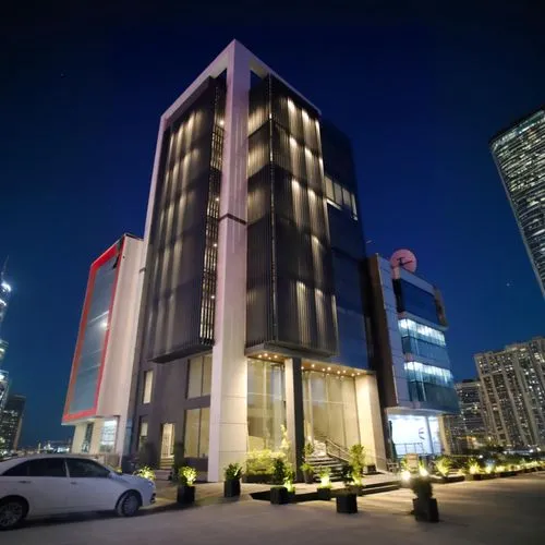 a view of a el building in the night,rotana,largest hotel in dubai,ajman,habtoor,abdali,mubadala