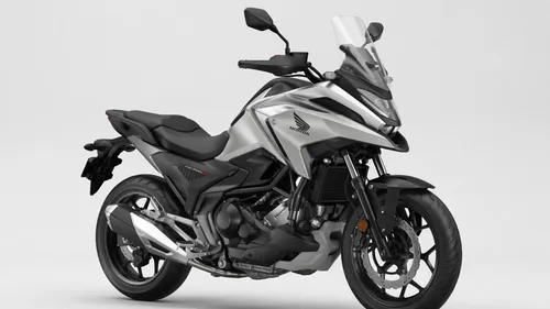 Honda NC750x, production year 2023
,a white and black motorcycle parked on top of a gray floor,electric motorcycle,e bike,minibike,moped,motor scooter,seat dragon,motorcycling,motorcycle,type 6500,mot