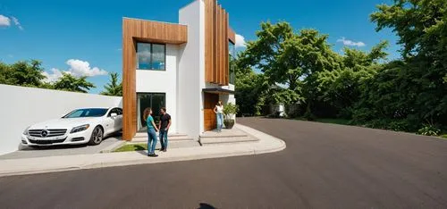 PHOTOGRAPH TAKEN WITH A KODAK CAMERA, WITH A 35MM LENS of a modern two-story house with a contemporary design. the house has a white exterior with wooden accents, and a large glass window on the secon